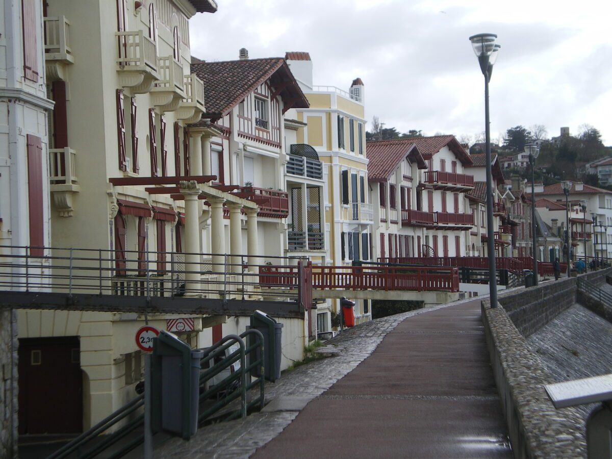 White Basque row houses with traditional red and black trim