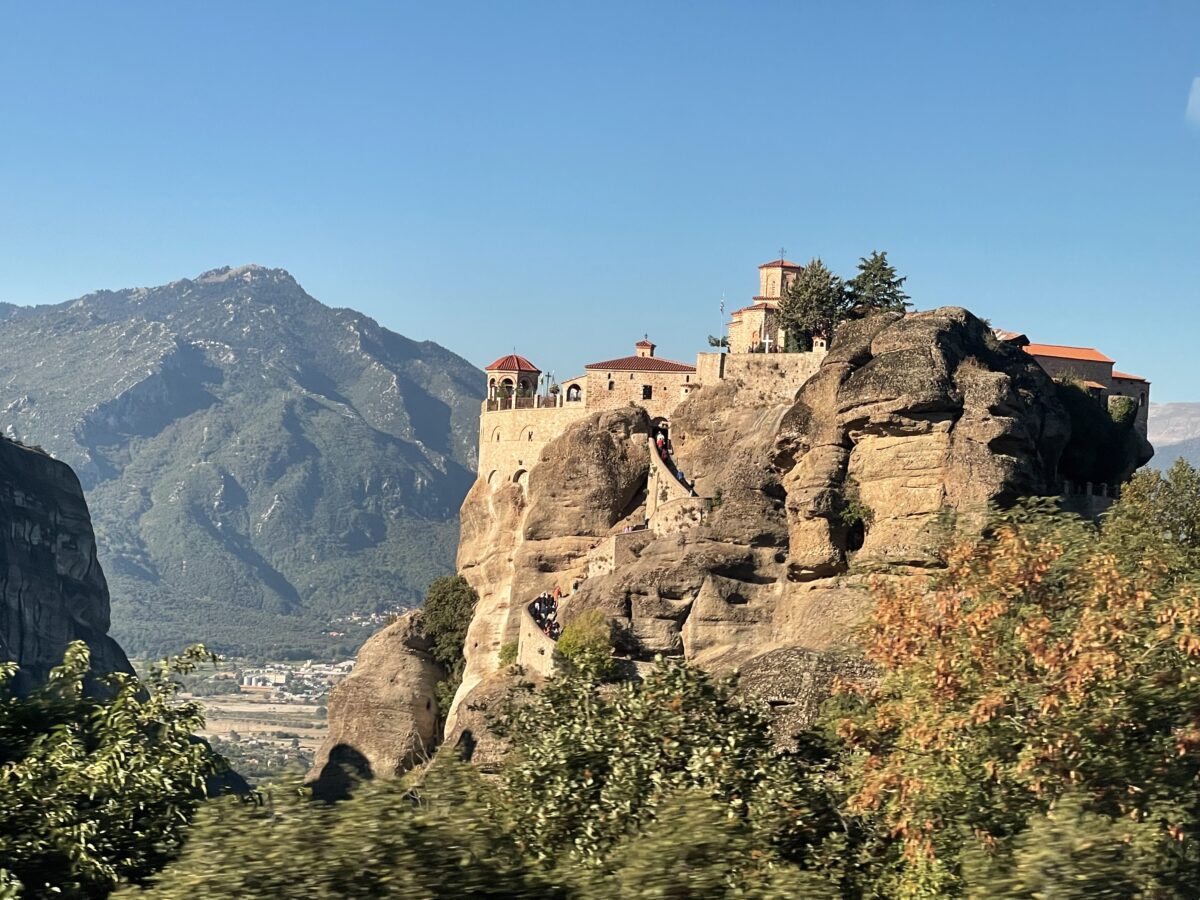 Stone Greek monastery on top of a tall rock pillar 