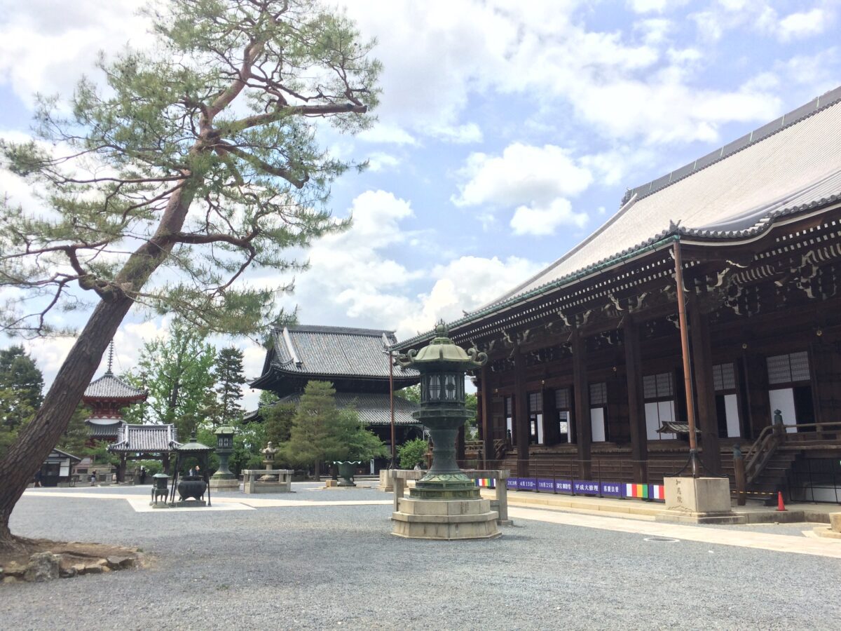 Courtyard in a Japanese temple with rock walkways and wooden buildings